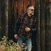 The Bomber Jacket in Navy Plaid Wool sold by Taylor Stitch