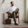 The Democratic Chino in Olive sold by Taylor Stitch