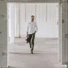 The Democratic Chino in Olive sold by Taylor Stitch