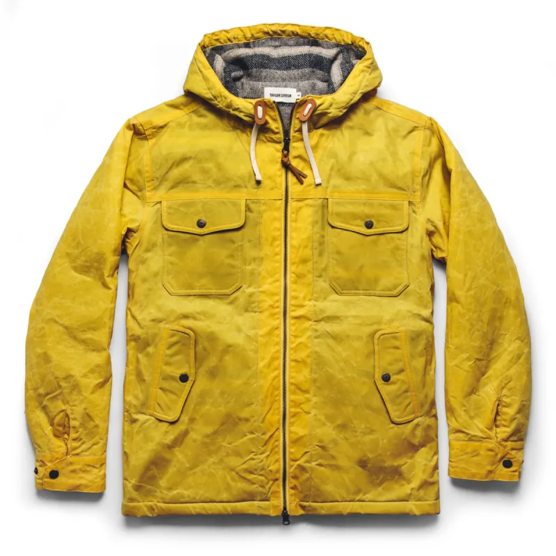 The Winslow Parka in Mustard Waxed Canvas sold by Taylor Stitch