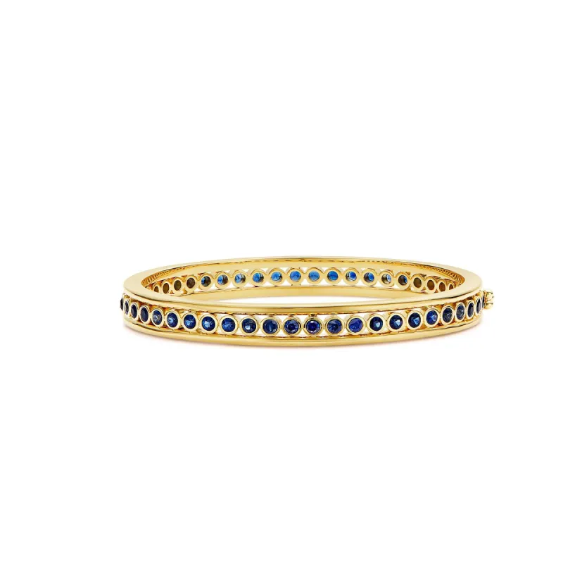 18K Blue Sapphire Eternity Bracelet sold by TEMPLE ST CLAIR