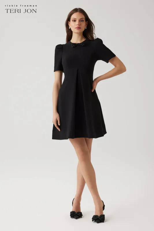 Crepe Puff Sleeve Jewel Bowtie Pleated Dress sold by Teri Jon