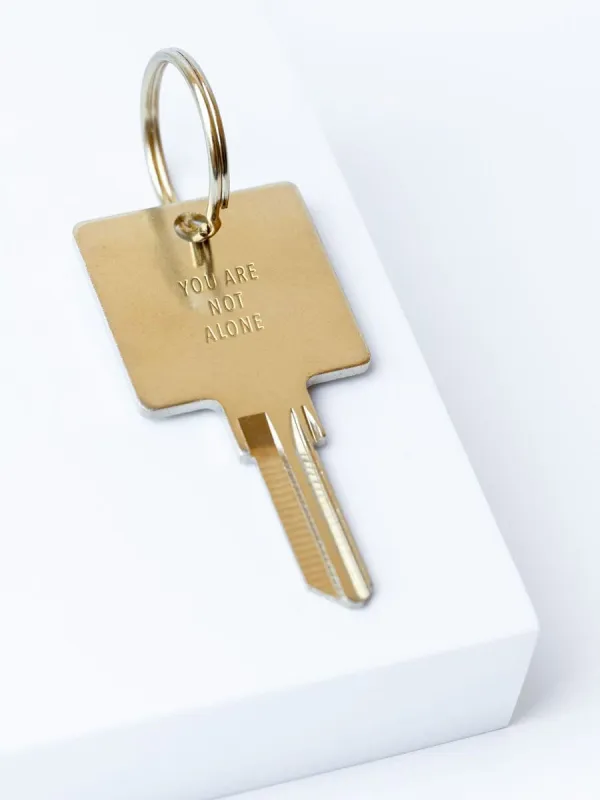 YOU ARE NOT ALONE Keychain sold by The Giving Keys