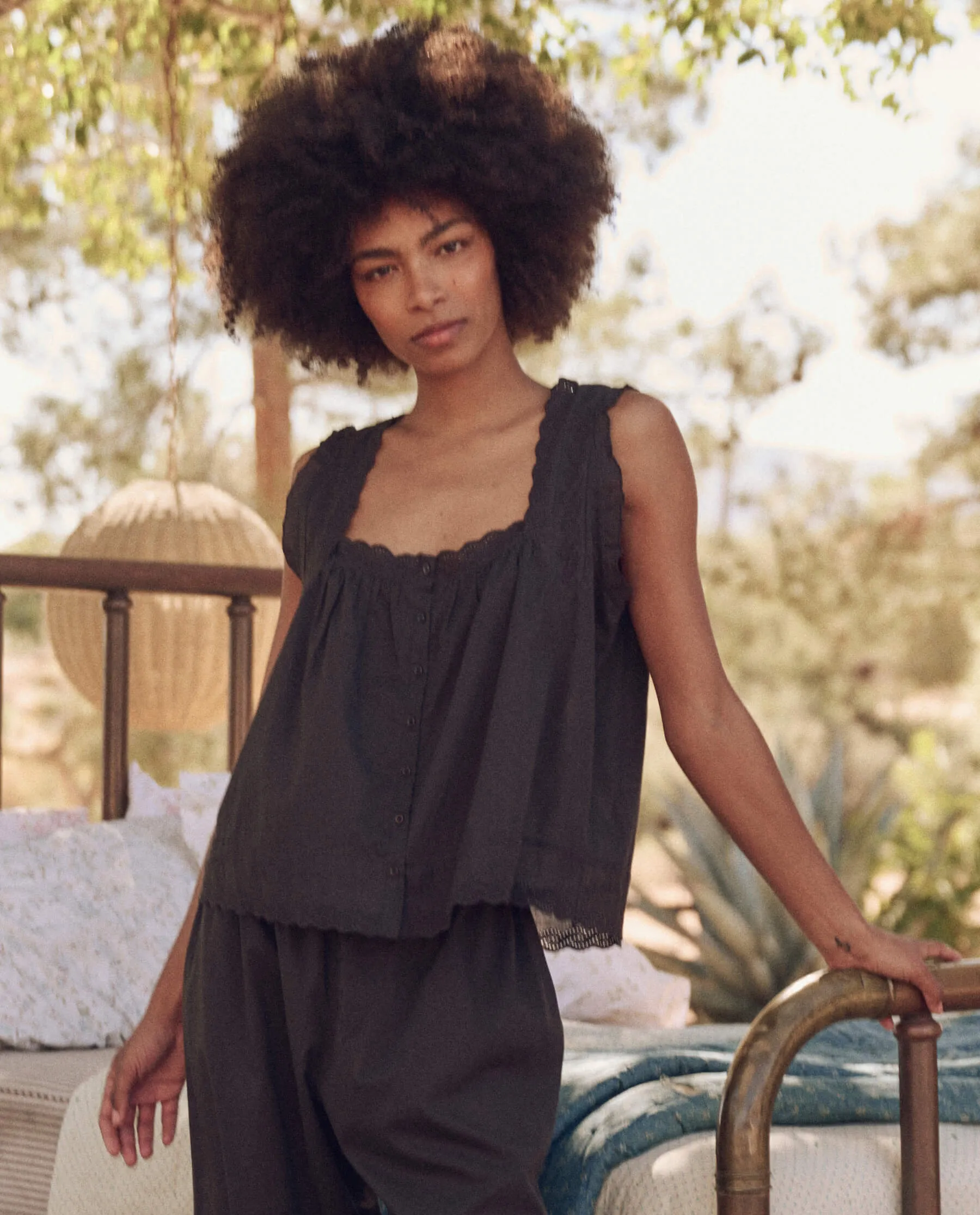 The Eyelet Tank. -- Black sold by THE GREAT.