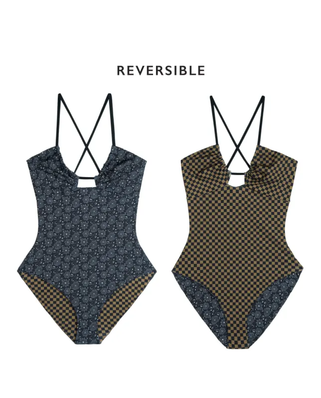 The Reversible Keyhole One Piece. -- Black Bandana Daisy and Bronze Check sold by THE GREAT.