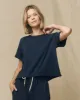 The Crop Tee. Solid -- True Navy sold by THE GREAT.
