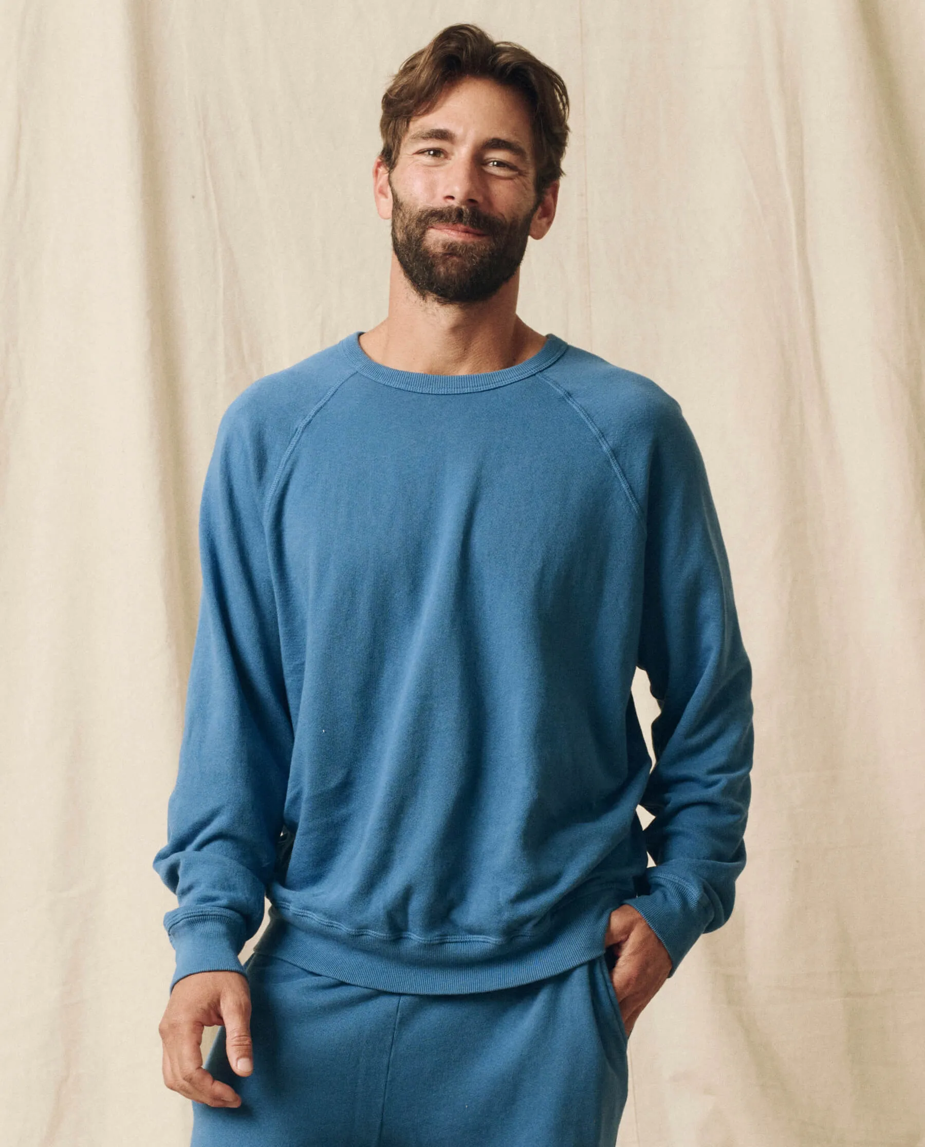 The Men's College Sweatshirt. Solid -- Glacier Blue sold by THE GREAT.