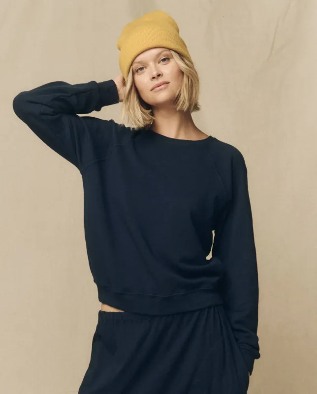 The Shrunken Sweatshirt. Solid -- True Navy sold by THE GREAT.