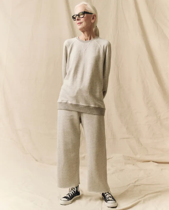 The Wide Leg Cropped Sweatpant. -- Soft Heather Grey sold by THE GREAT.
