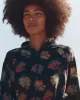 The Quarter Zip Trail Pullover. -- Black Palisade Floral sold by THE GREAT.