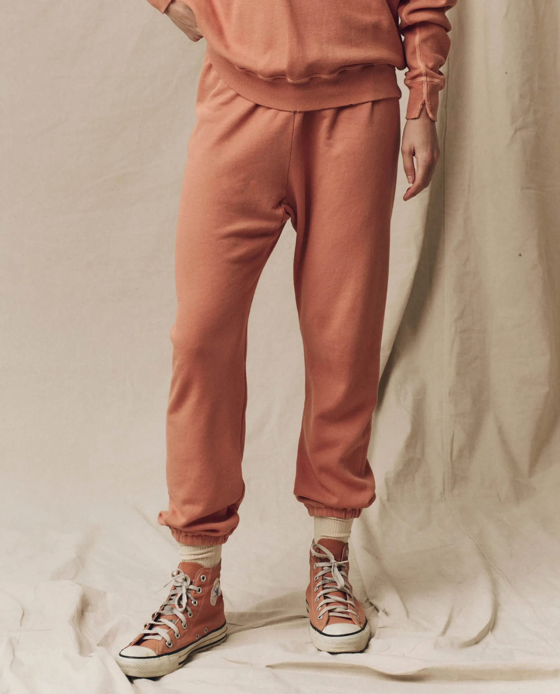 The Stadium Sweatpant. Solid -- Sun Dried Orange sold by THE GREAT.