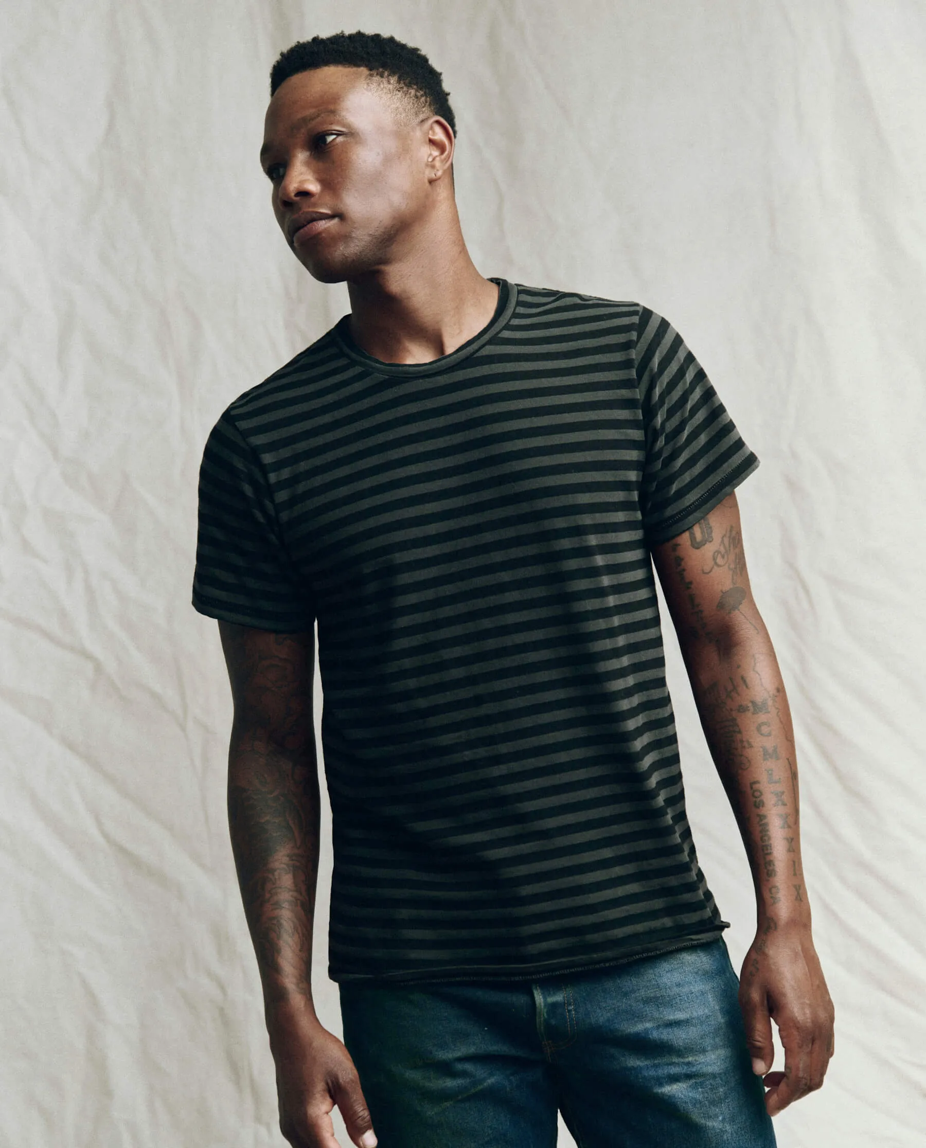 The Men's Slim Tee. -- Black and Charcoal Stripe sold by THE GREAT.