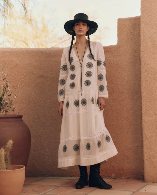 The Taos Dress with Folklore Embroidery. -- Cream sold by THE GREAT.