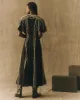 The Dancehall Dress. -- Black with Cream sold by THE GREAT.