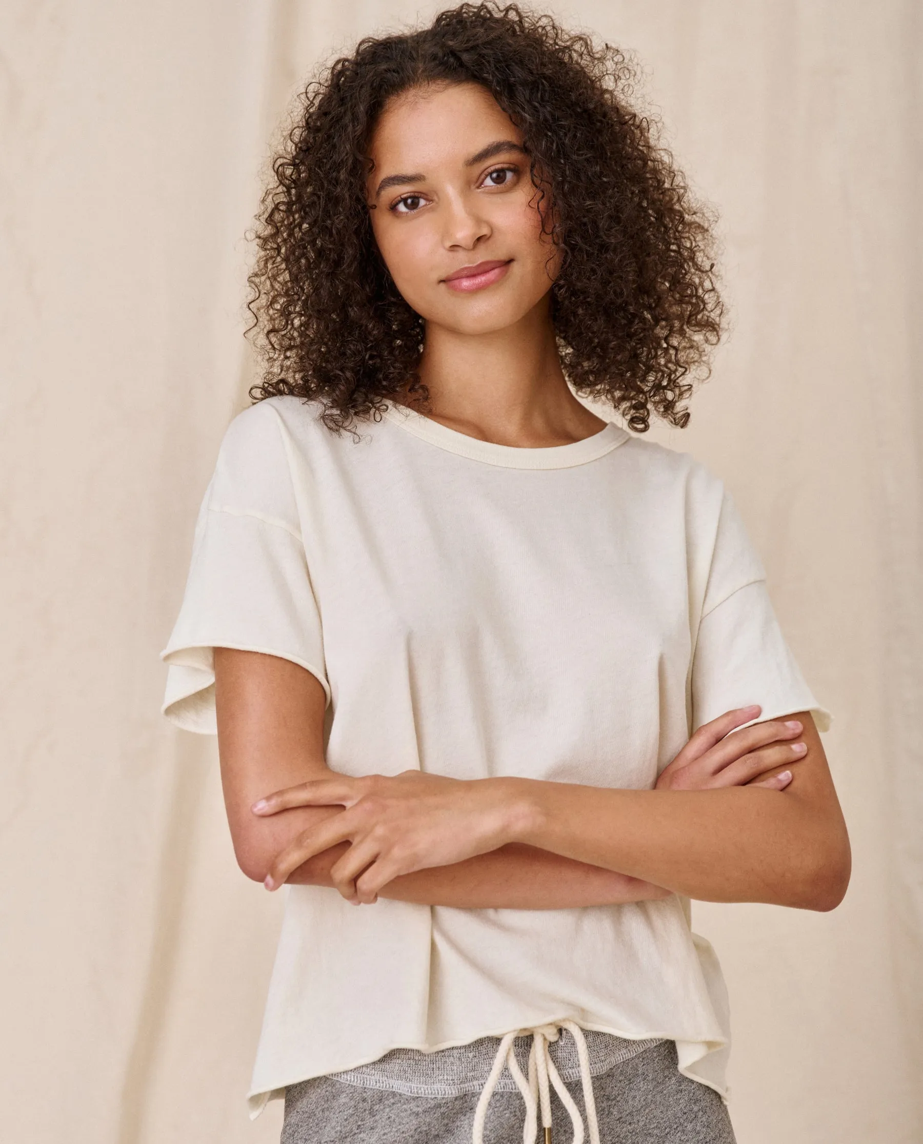 The Crop Tee. Solid -- Washed White sold by THE GREAT.