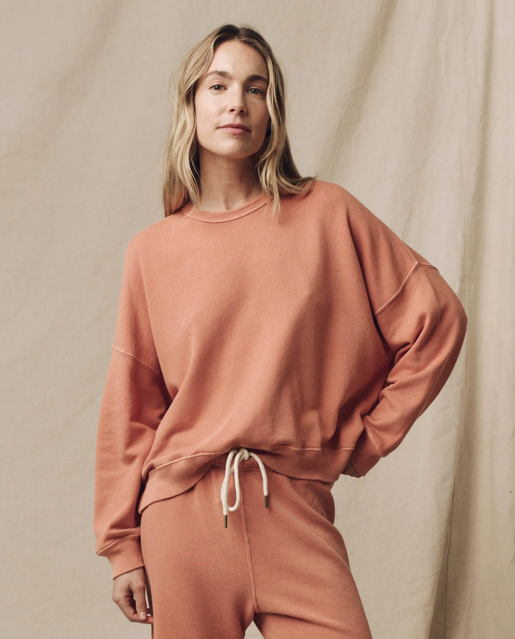 The Teammate Sweatshirt. Solid -- Sun Dried Orange sold by THE GREAT.