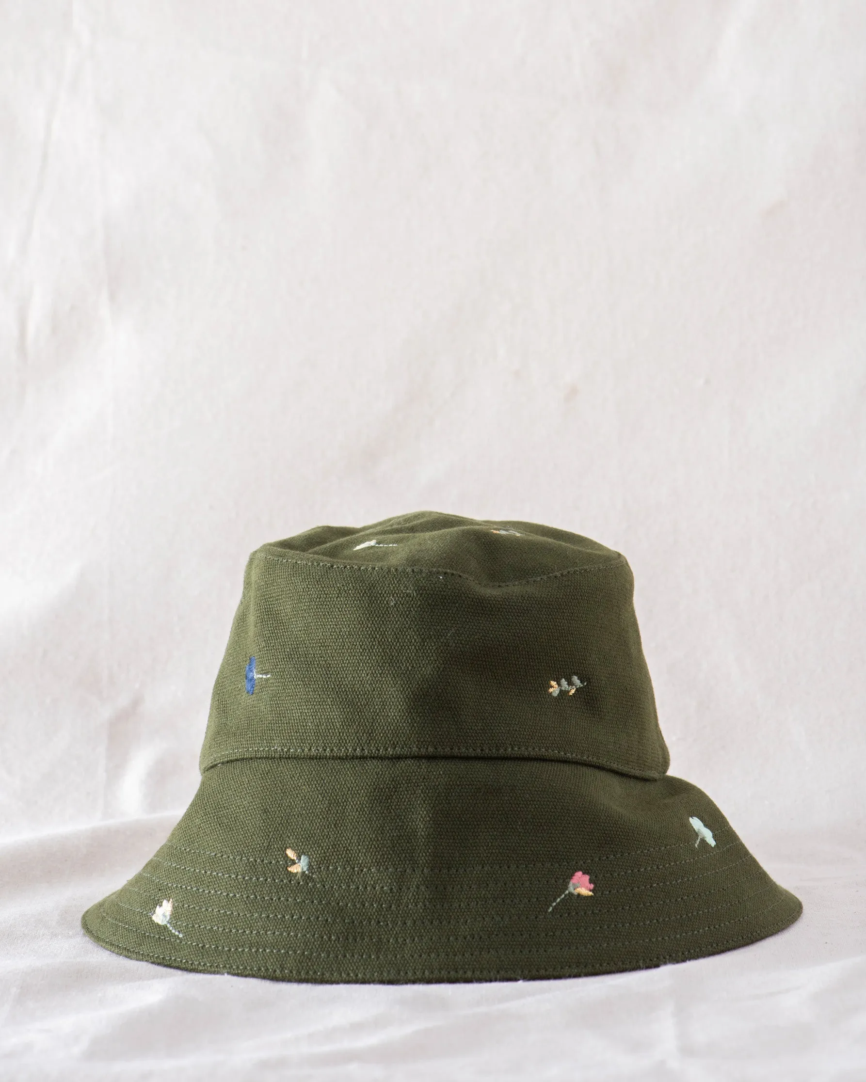The Bucket Hat. -- Army with Tossed Floral Embroidery sold by THE GREAT.