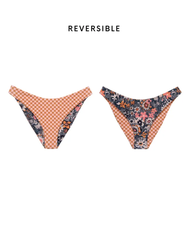 The Reversible Cheeky Brief. -- Navy Heirloom Floral and Sunset Check sold by THE GREAT.