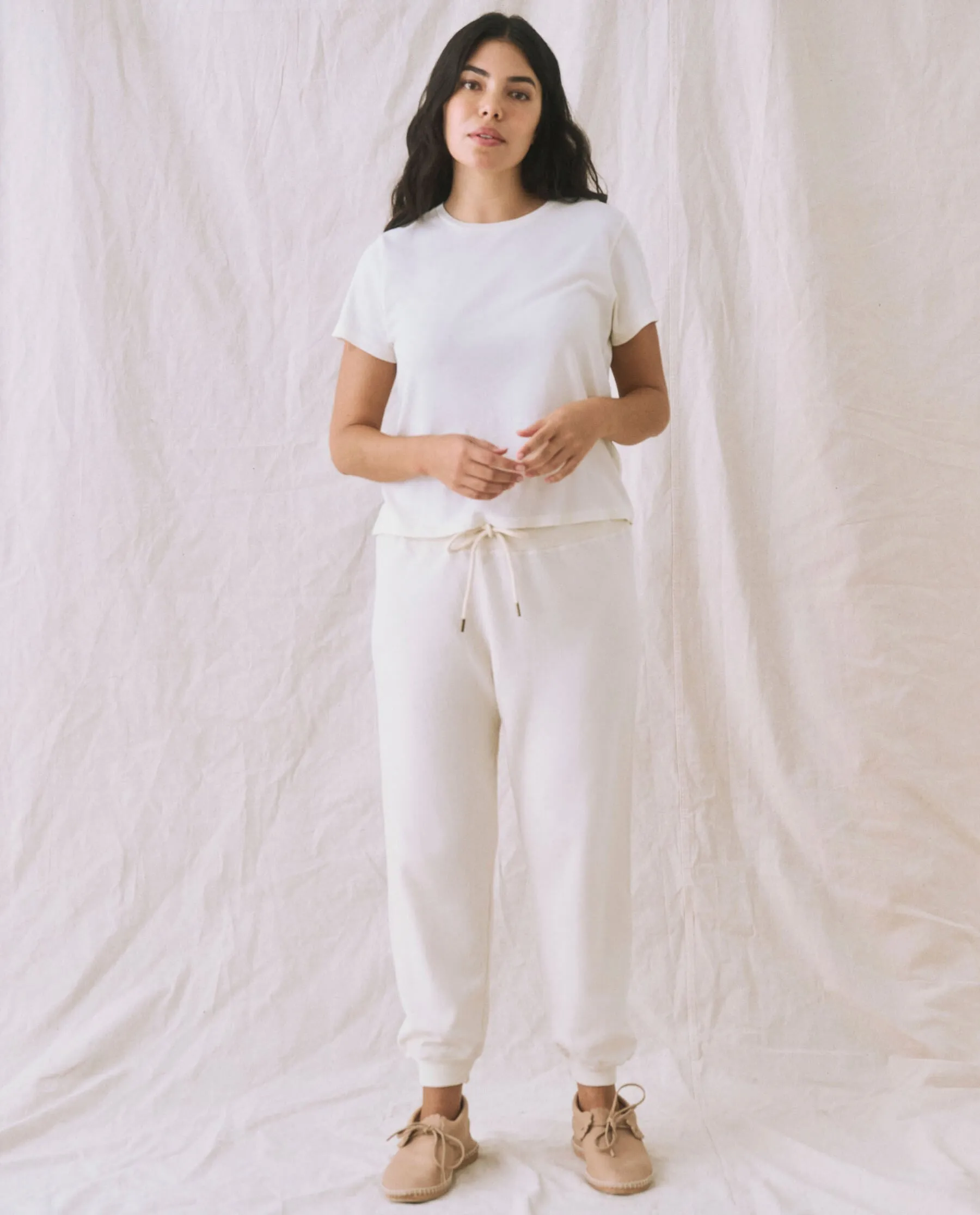 The Cropped Sweatpant. Solid -- Washed White sold by THE GREAT.