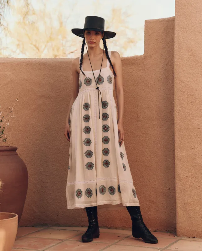 The Roam Dress with Folklore Embroidery. -- Cream sold by THE GREAT.