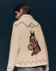 The Horse Lodge Cardigan. -- Cream sold by THE GREAT.