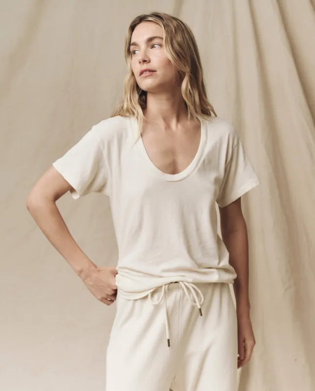 The Slim U-Neck Tee. Solid -- Washed White sold by THE GREAT.
