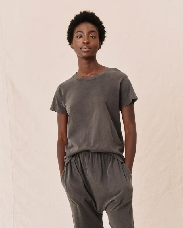 The Slim Tee. Solid -- Washed Black sold by THE GREAT.