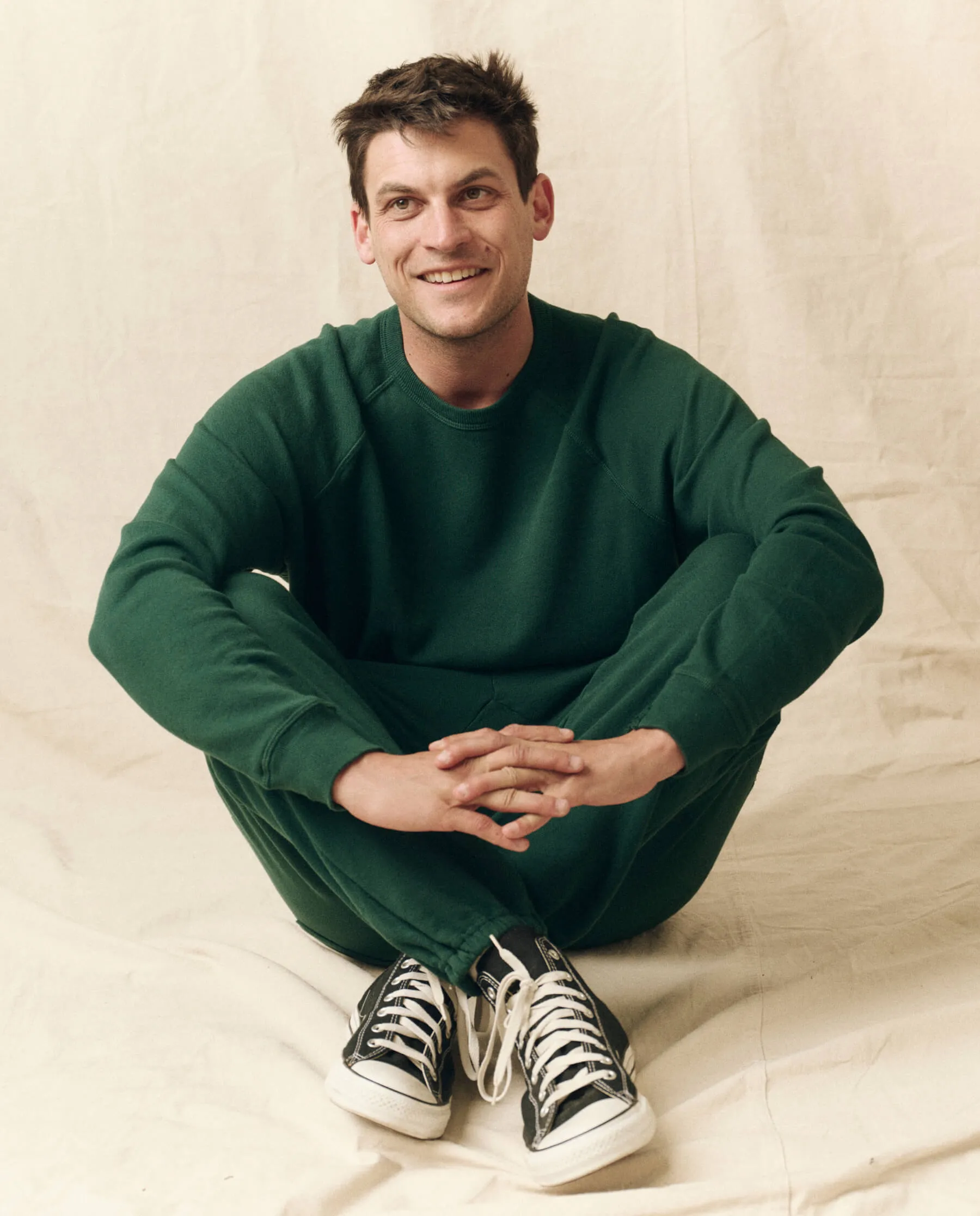 The Men's College Sweatshirt. -- Green Grove sold by THE GREAT.