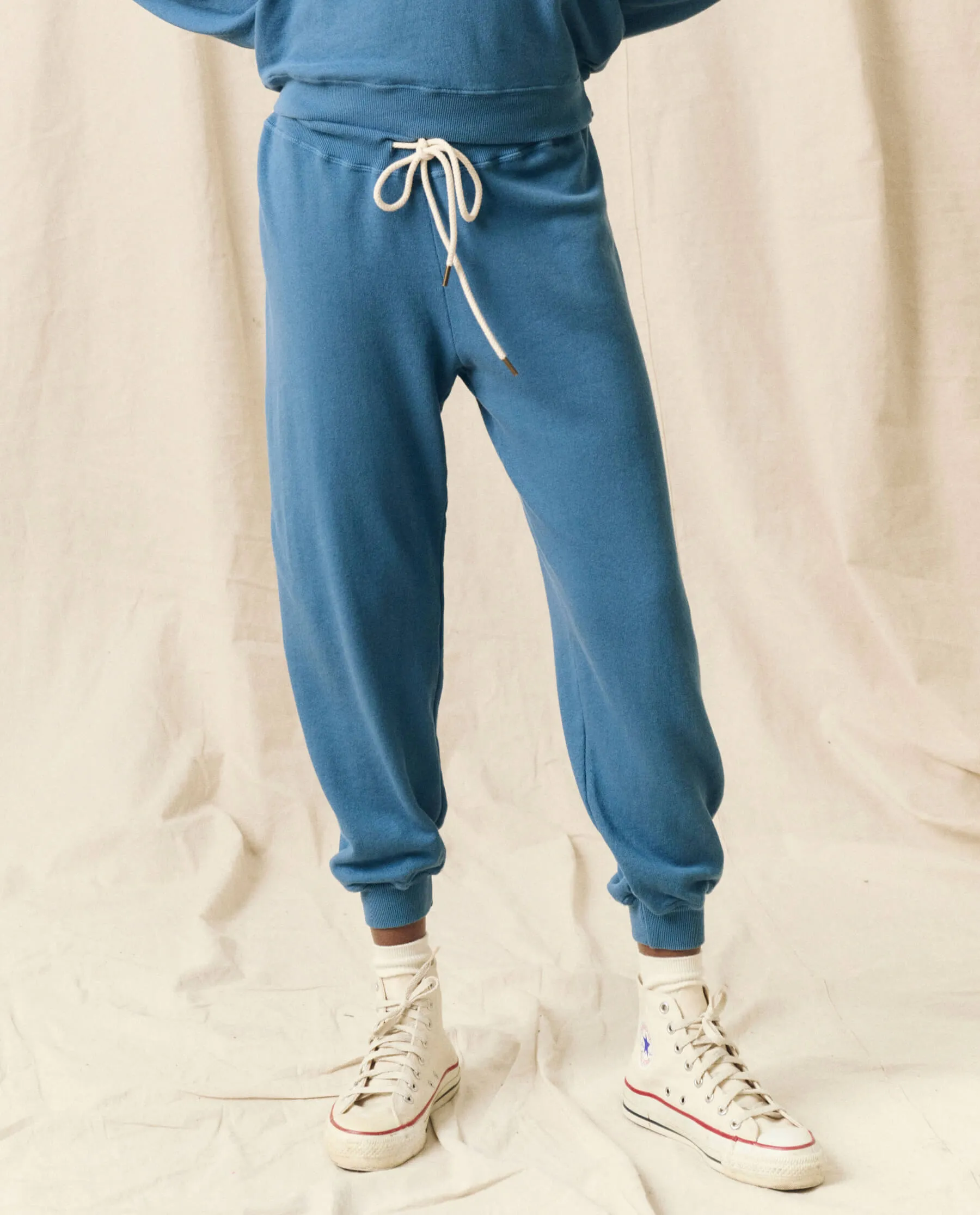 The Cropped Sweatpant. Solid -- Glacier Blue sold by THE GREAT.