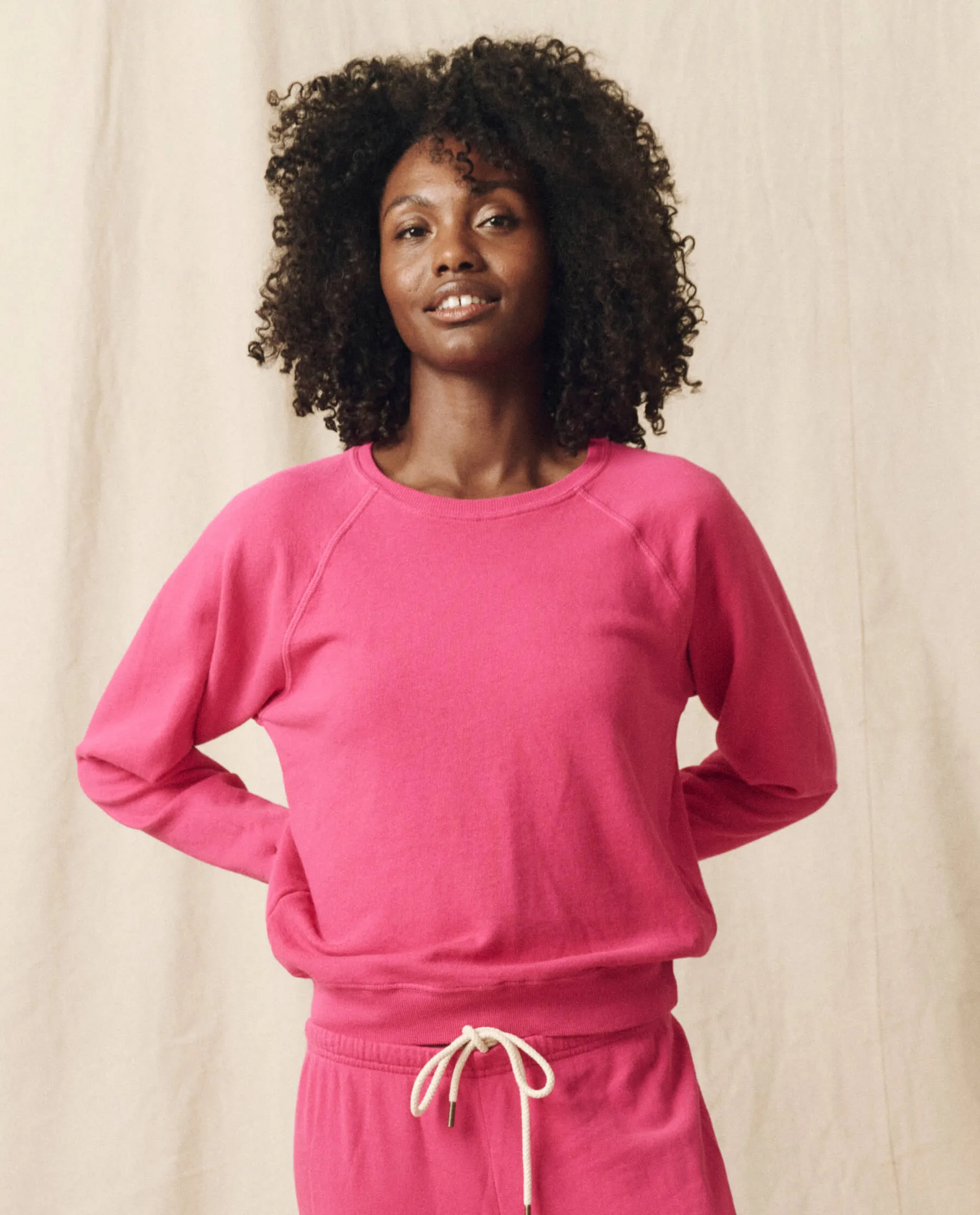 The Shrunken Sweatshirt. Solid -- Fuchsia sold by THE GREAT.