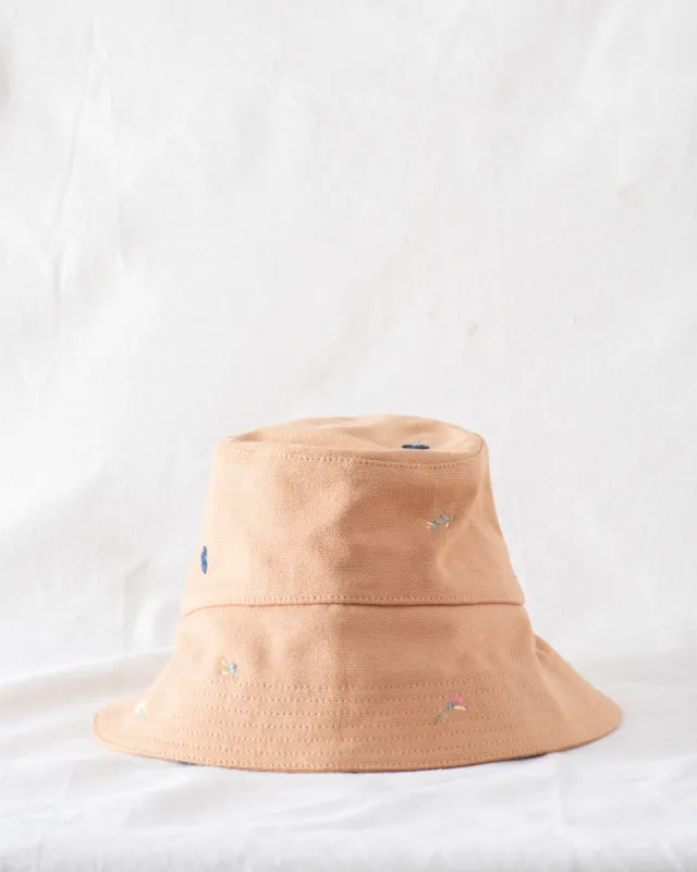 The Bucket Hat. -- Camel with Tossed Floral Embroidery sold by THE GREAT.