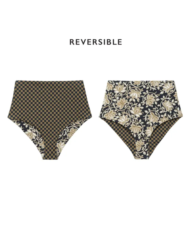 The Reversible Mid-Rise Brief. -- Black Oasis Floral and Bronze Check sold by THE GREAT.