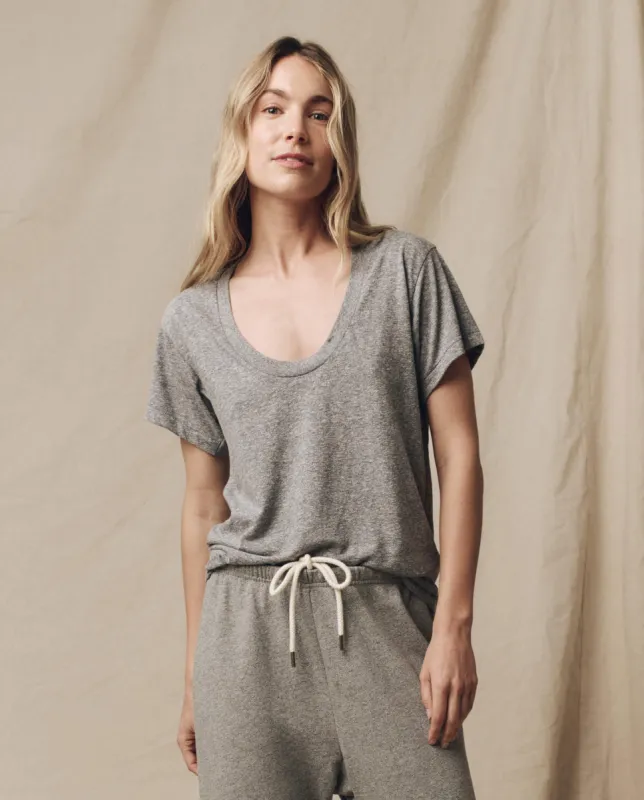 The Slim U-Neck Tee. Solid -- Heather Grey sold by THE GREAT.