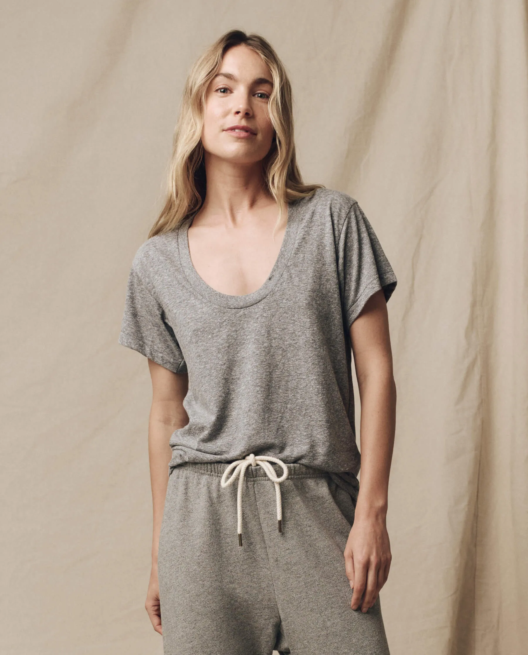 The Slim U-Neck Tee. Solid -- Heather Grey sold by THE GREAT.