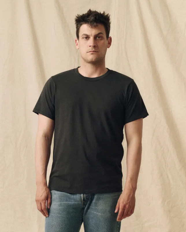 The Men's Pure Knits Slim Tee. Solid -- Almost Black sold by THE GREAT.