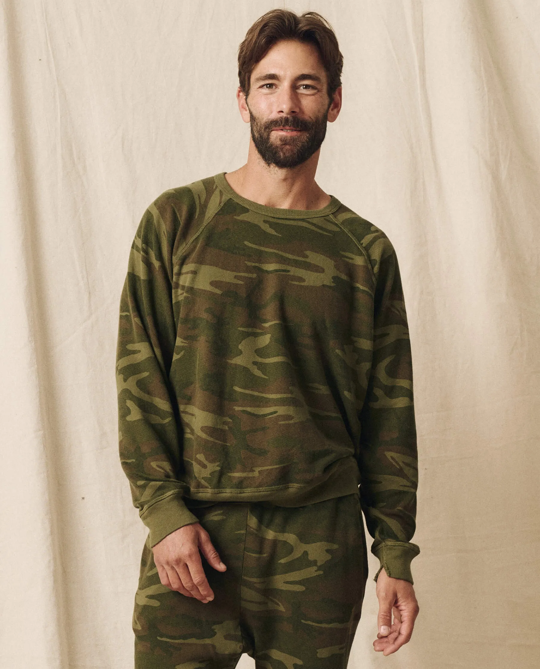 The Men's College Sweatshirt. -- Deep Woods Camo sold by THE GREAT.