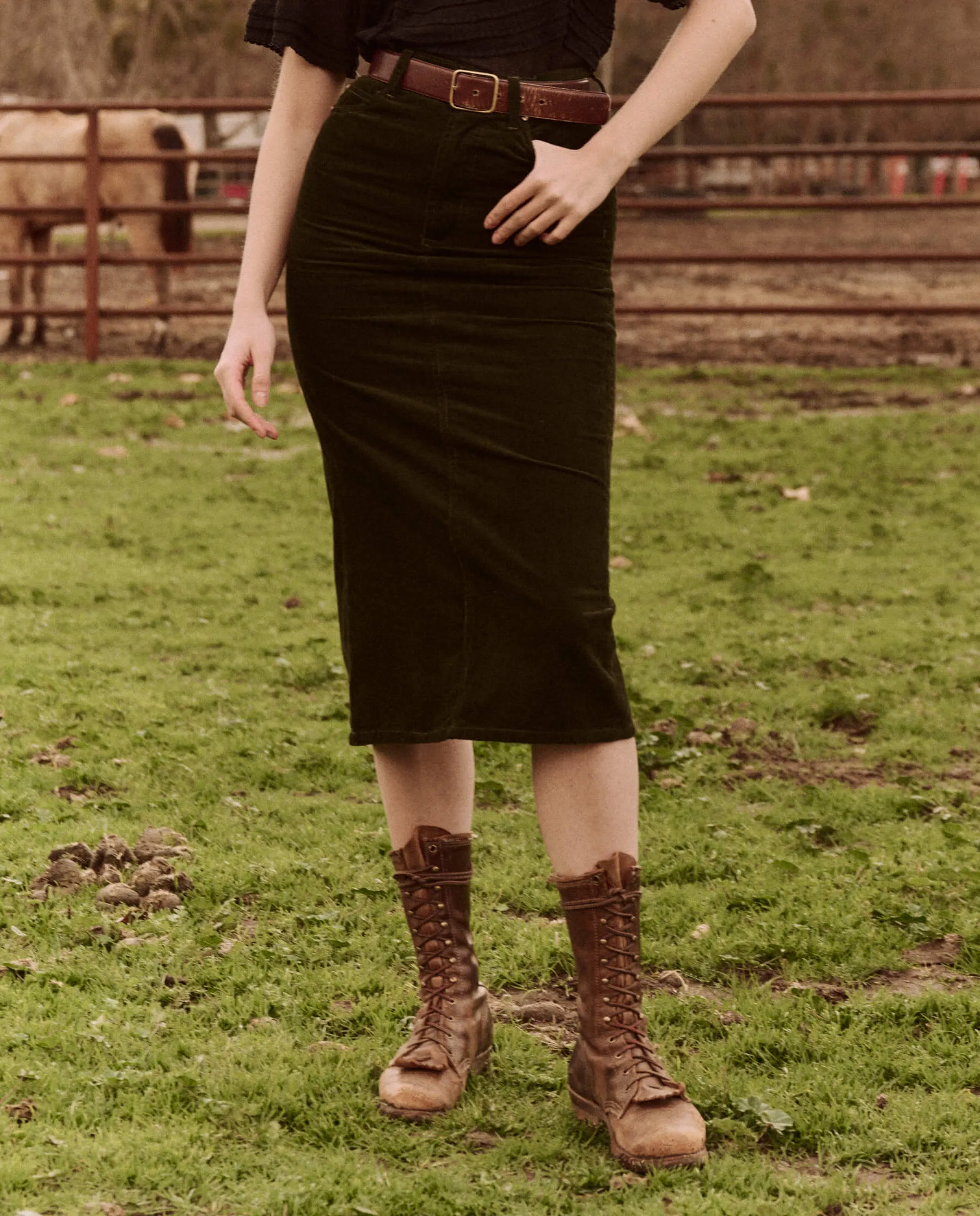 The Column Skirt. Cord -- Woodland Green sold by THE GREAT.