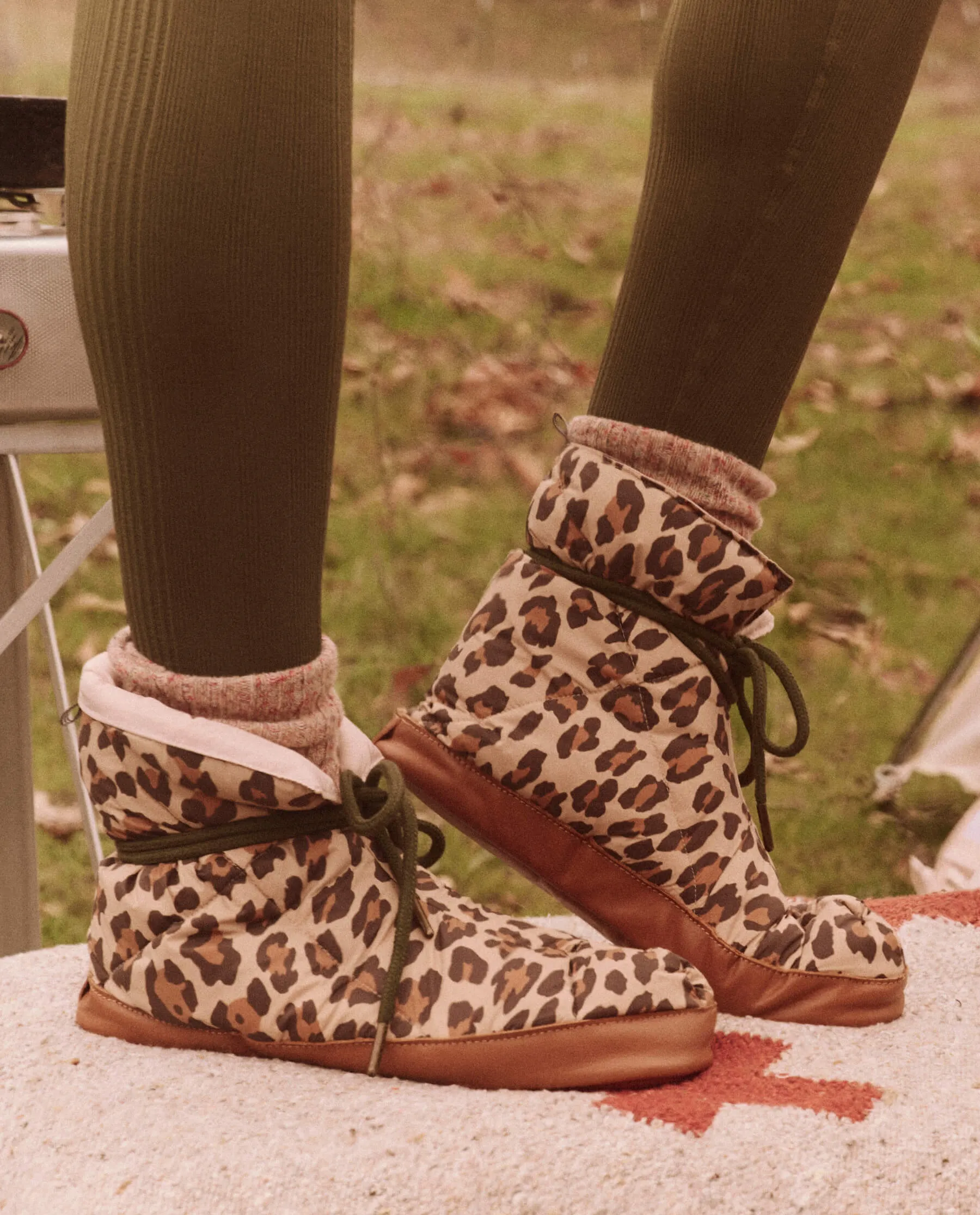 The Down Quilted Puffer Slipper. -- Snow Leopard sold by THE GREAT.