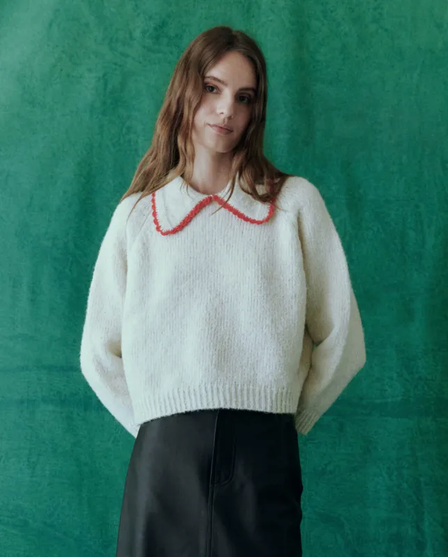 The Crochet Collar Pullover. -- Soft White with Cherry sold by THE GREAT.