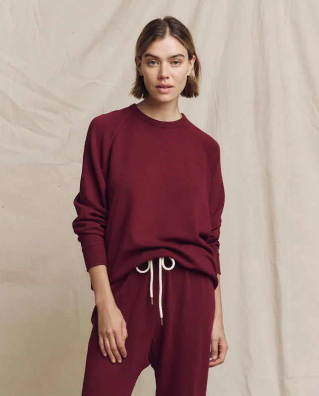 The College Sweatshirt. Solid -- Plum sold by THE GREAT.