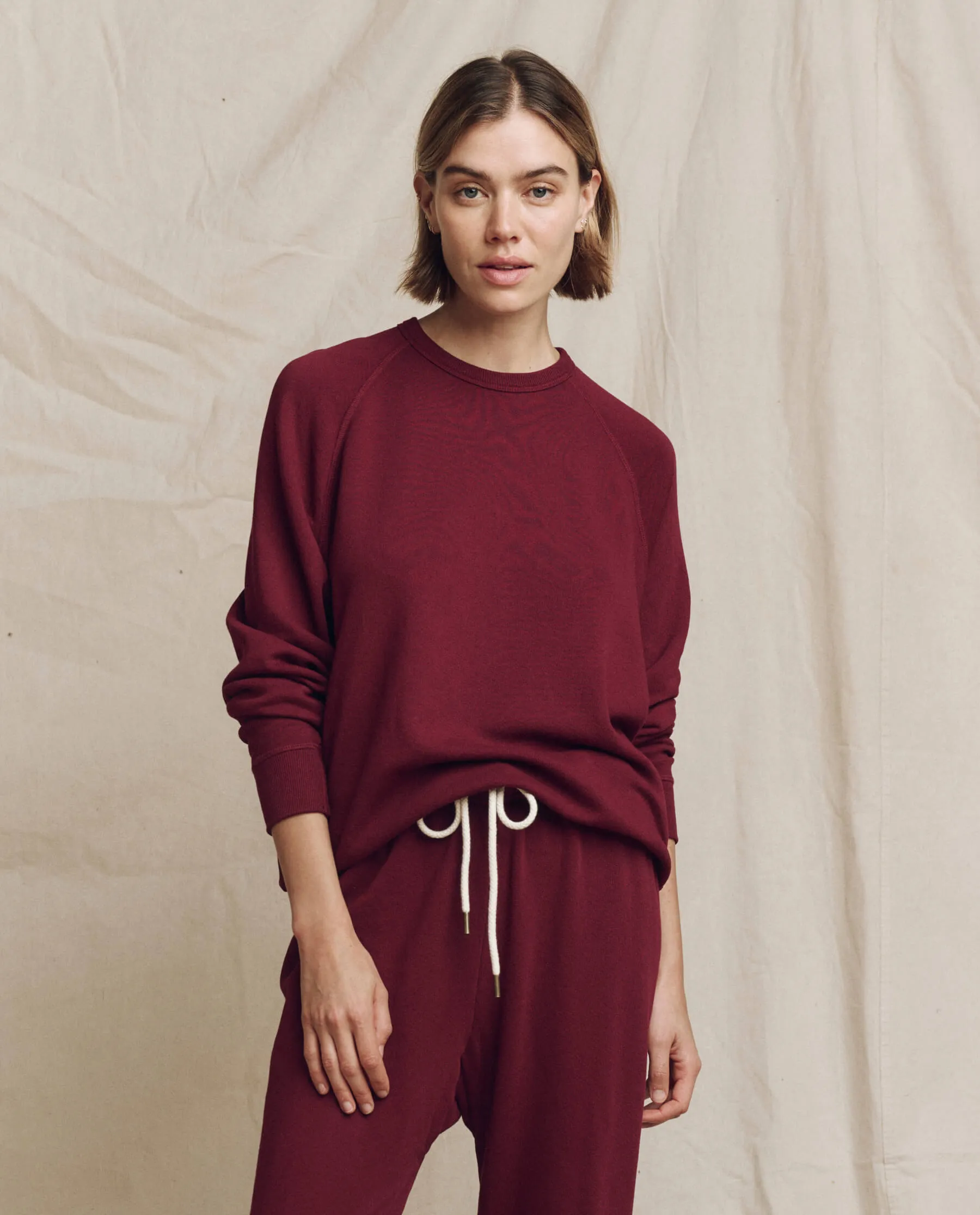 The College Sweatshirt. Solid -- Plum sold by THE GREAT.