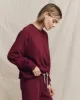 The College Sweatshirt. Solid -- Plum sold by THE GREAT.