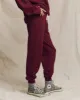 The Cropped Sweatpant. Solid -- Plum sold by THE GREAT.
