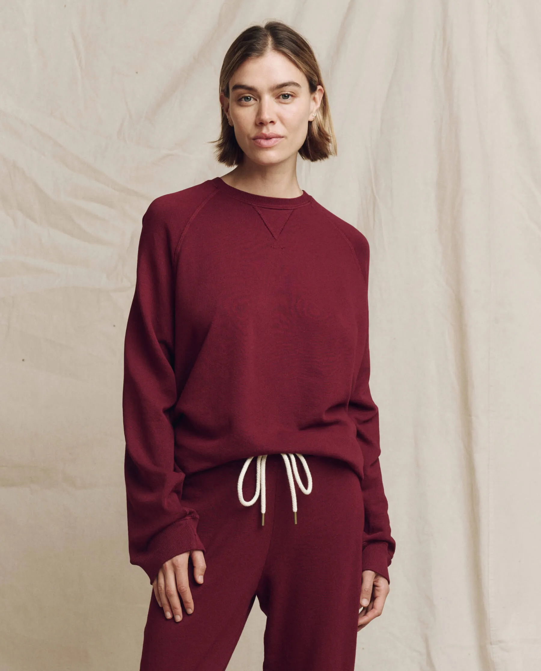 The Slouch Sweatshirt. Solid -- Plum sold by THE GREAT.