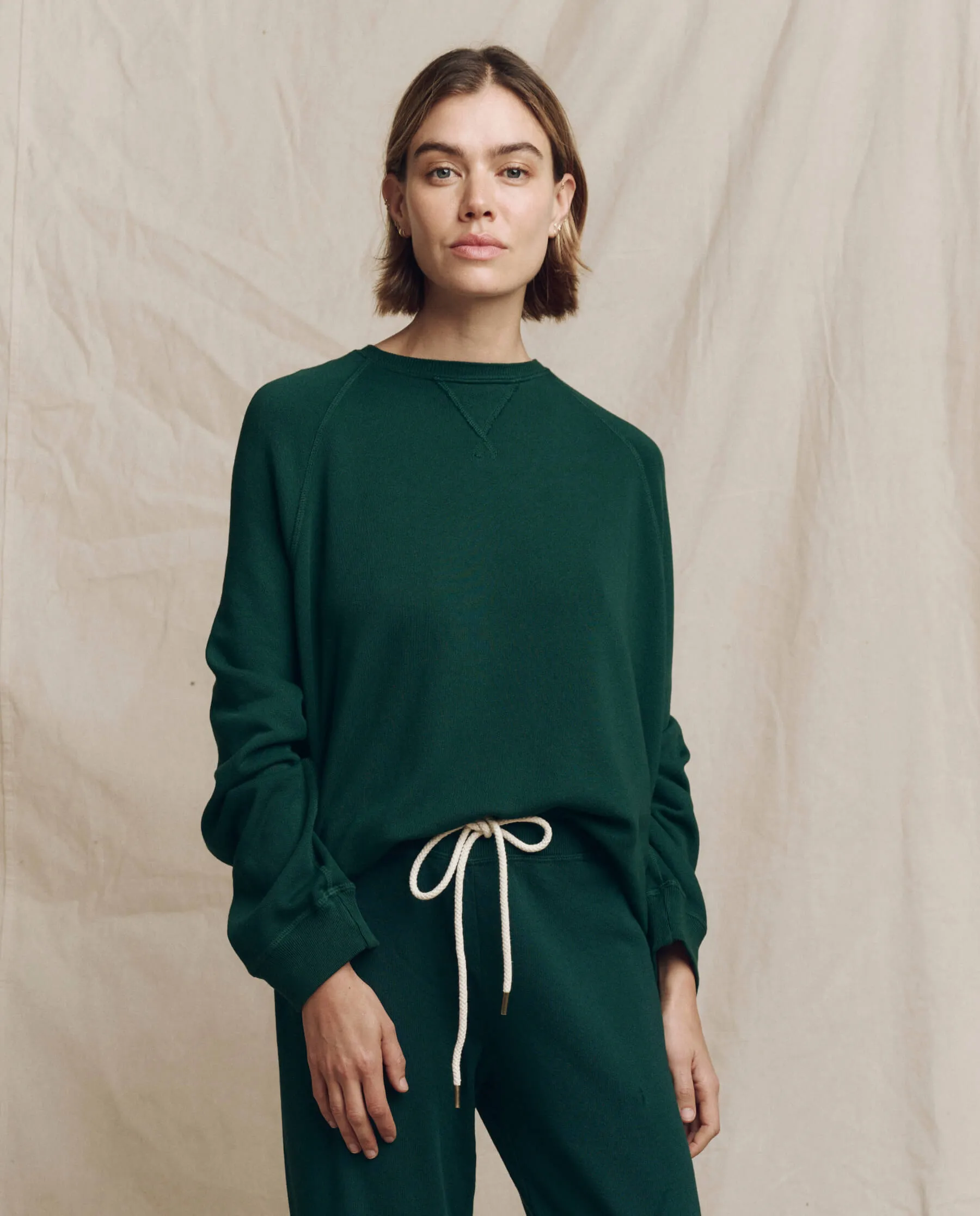The Slouch Sweatshirt. Solid -- Pinyon sold by THE GREAT.