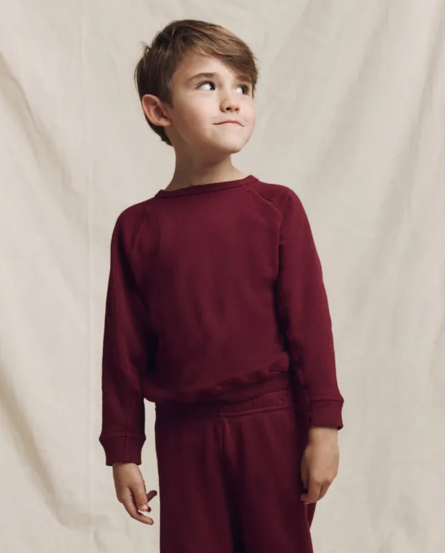 The Little College Sweatshirt. Solid -- Plum sold by THE GREAT.