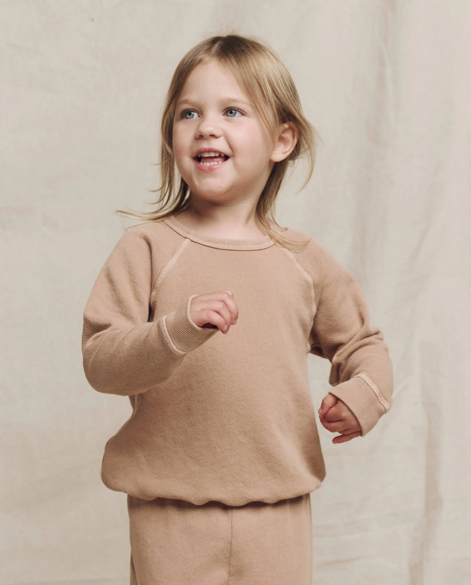 The Little College Sweatshirt. Solid -- Biscotti sold by THE GREAT.