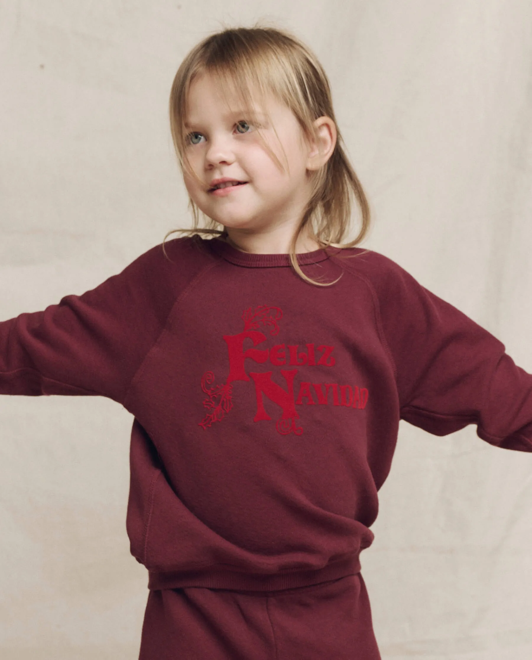 The Little College Sweatshirt. Graphic -- Mulled Wine with Feliz Navidad Graphic sold by THE GREAT.