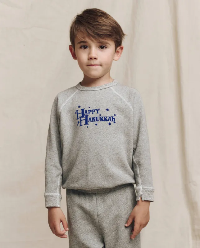 The Little College Sweatshirt. Graphic -- Varsity Grey with Hannukah Graphic sold by THE GREAT.