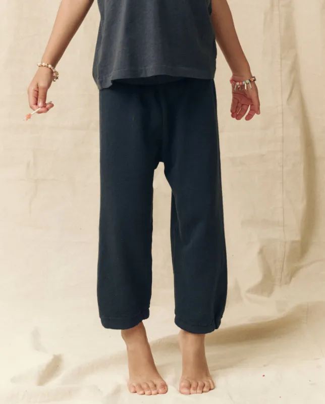 The Little Stadium Sweatpant. Solid -- True Navy sold by THE GREAT.